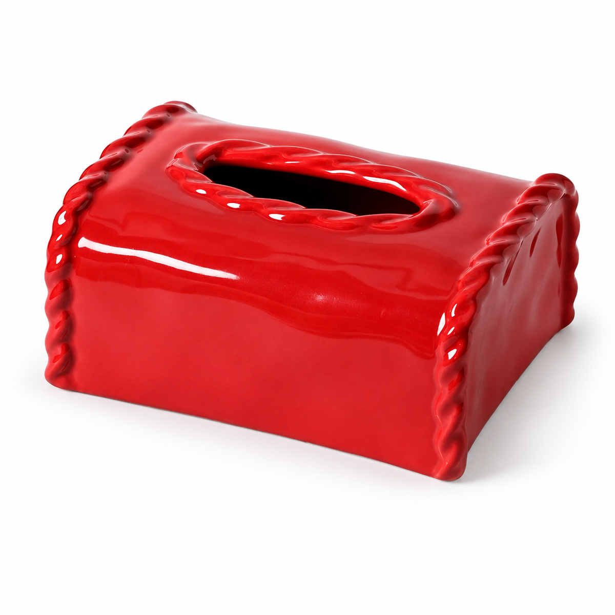 Bright red glossy ceramic tissue box cover with sculpted twist edges and oval opening on a white background.