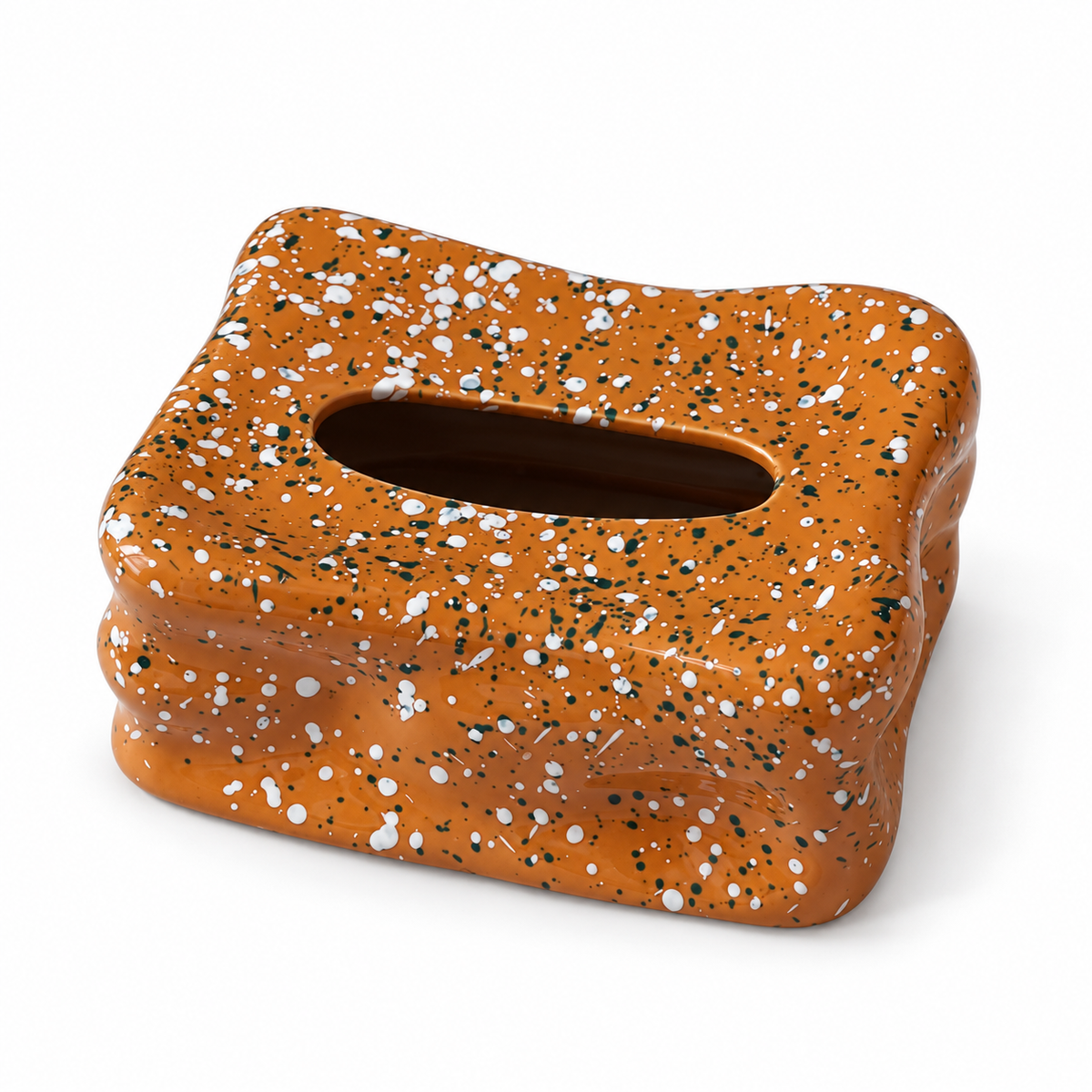 Terracotta ceramic tissue box cover with white and dark speckles, wavy folds and an empty oval opening.