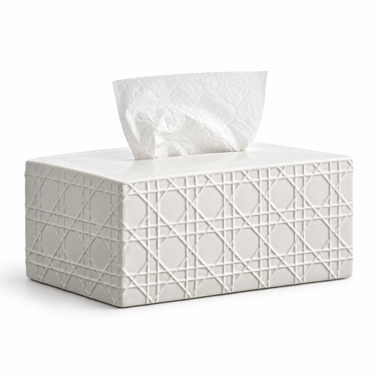 Matte white ceramic tissue box cover with raised cannage pattern, a smooth top and a white tissue.