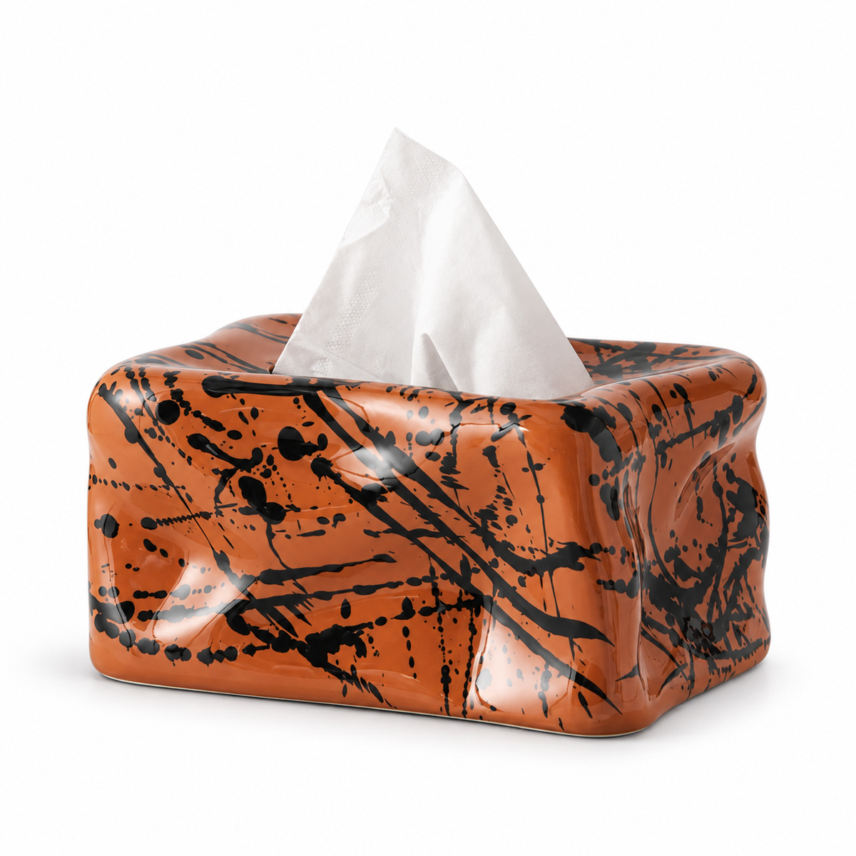 Terracotta Splash glossy ceramic tissue cover with black gestural splatter on a white background.