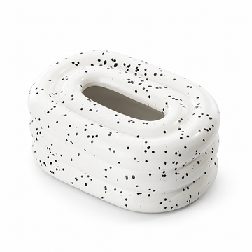 Ink-Speckled Pearl ceramic tissue box cover with rounded tiers and an oval top opening on a white background.