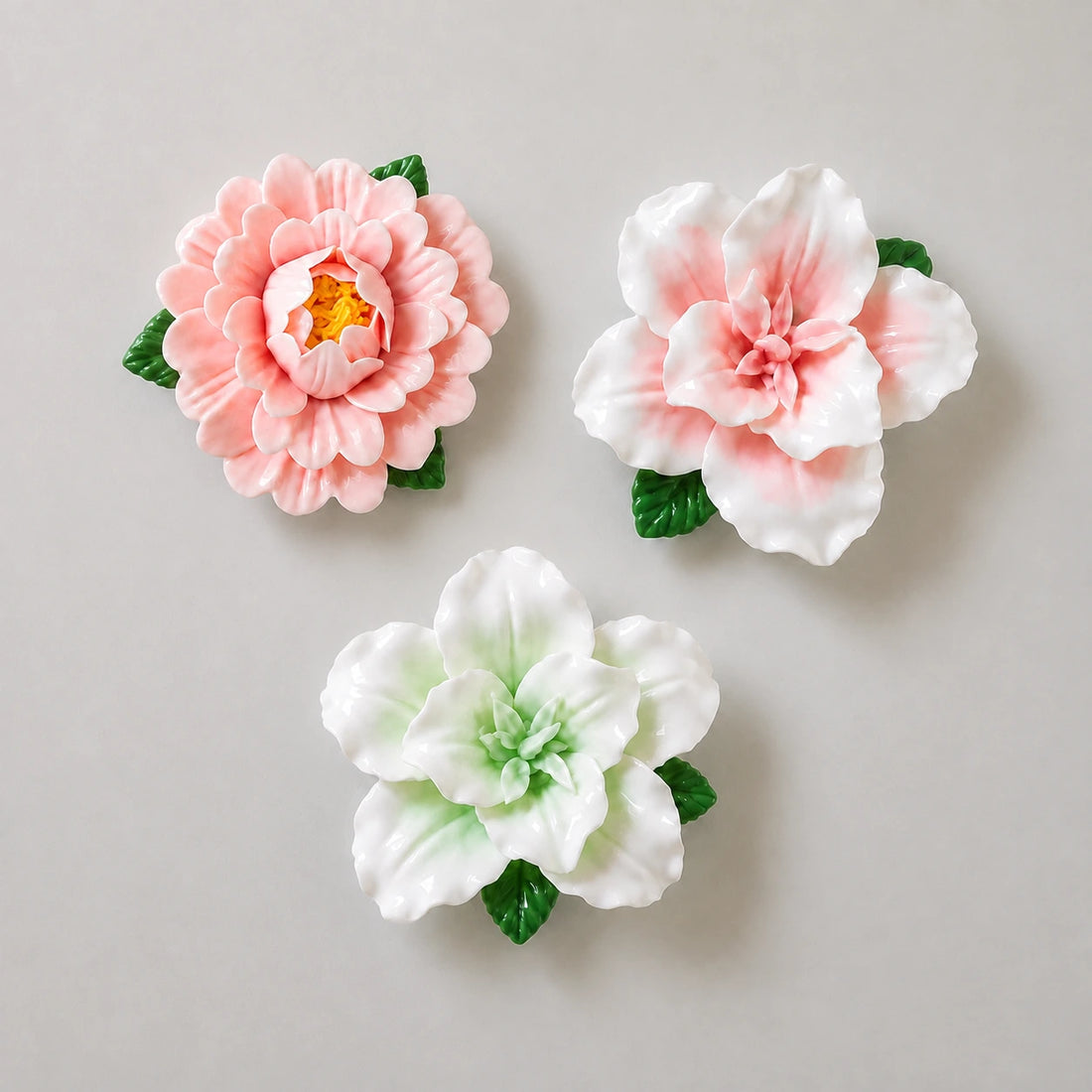 Blush Garden ceramic magnet trio: one pink peony, one pink lily and one pale-green lily.
