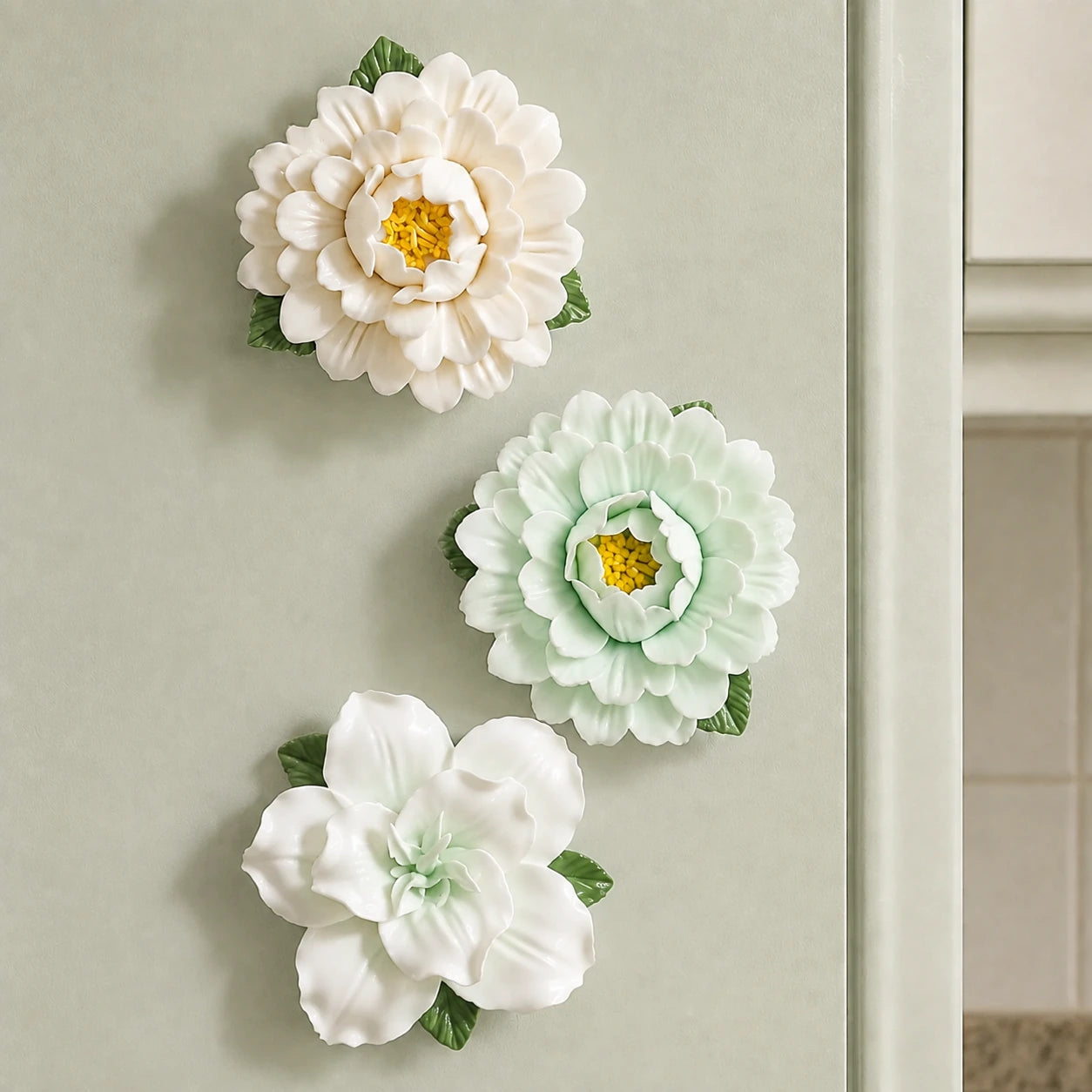 Sage & Ivory white and pale-green peonies and a pale-green lily arranged down a light-sage metal cabinet door.