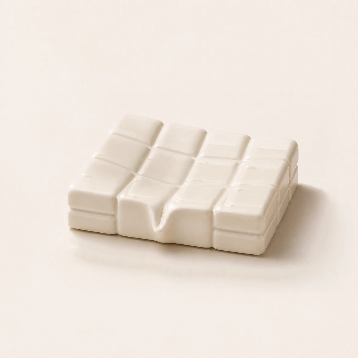 Glossy milk sculptural ceramic soap dish with a shallow twelve-tile basin