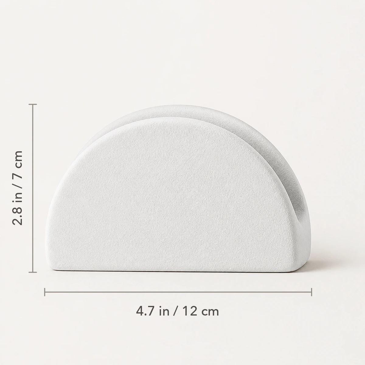 Front view of white ceramic napkin holder marked 4.7 inches wide by 2.8 inches high