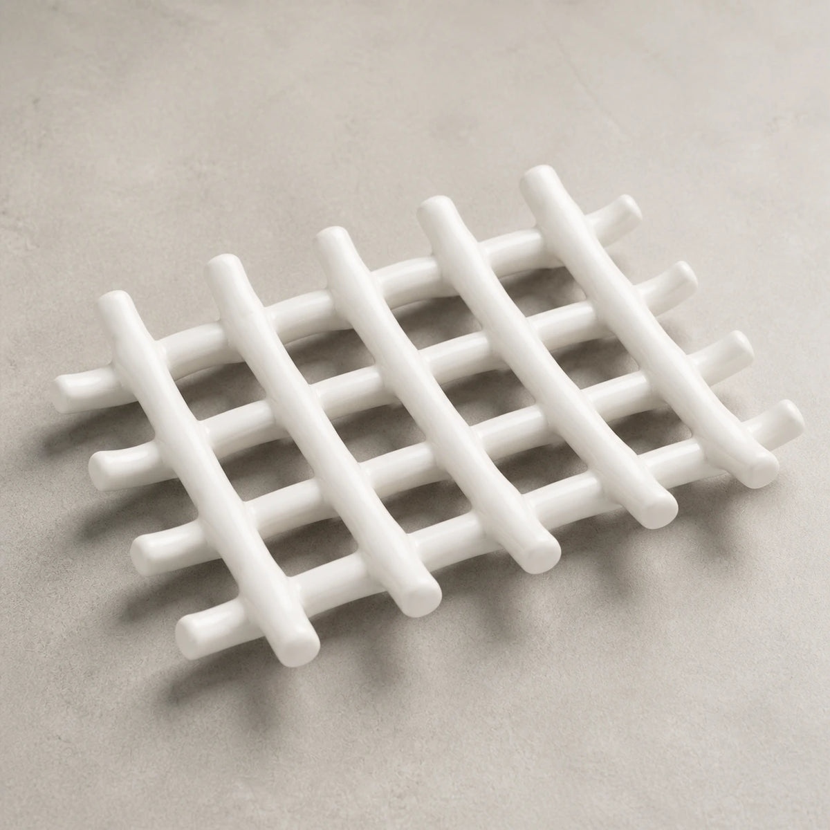 Close view of the white ceramic rods, open grid and curved branch ends