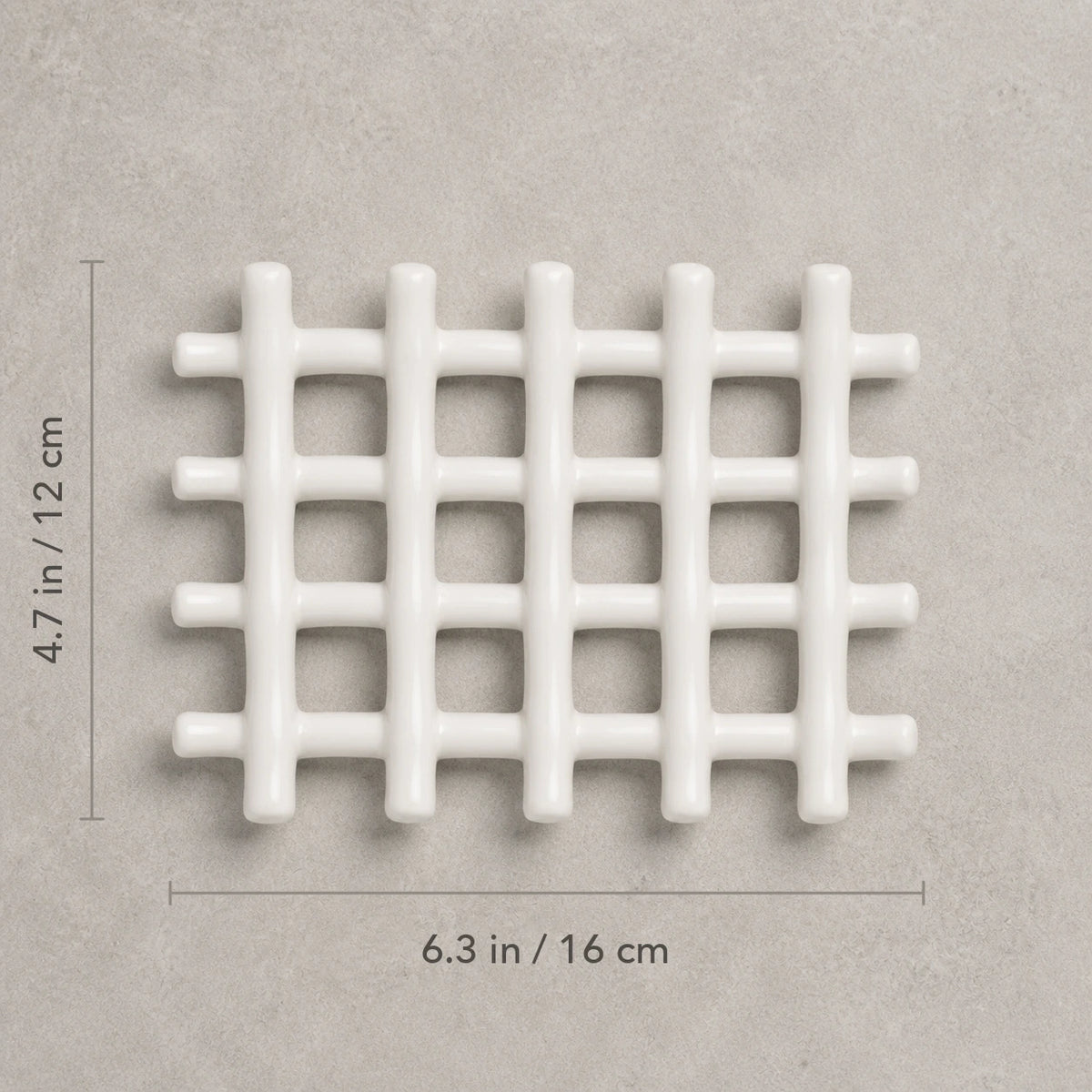 Top view of the white ceramic soap dish marked 6.3 by 4.7 inches