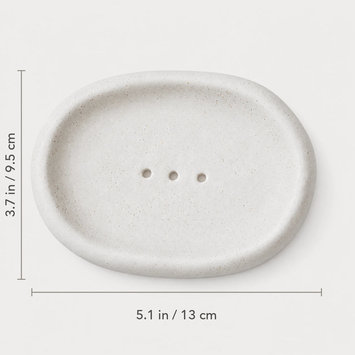 Top view of Matte Speckled Cloud ceramic dish marked 5.1 by 3.7 inches