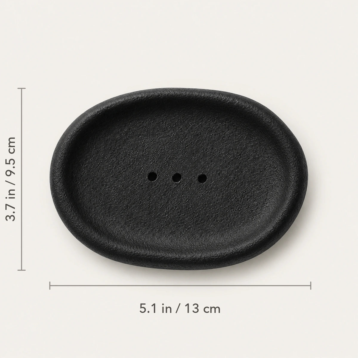 Top view of Vulcanized Obsidian ceramic dish marked 5.1 by 3.7 inches