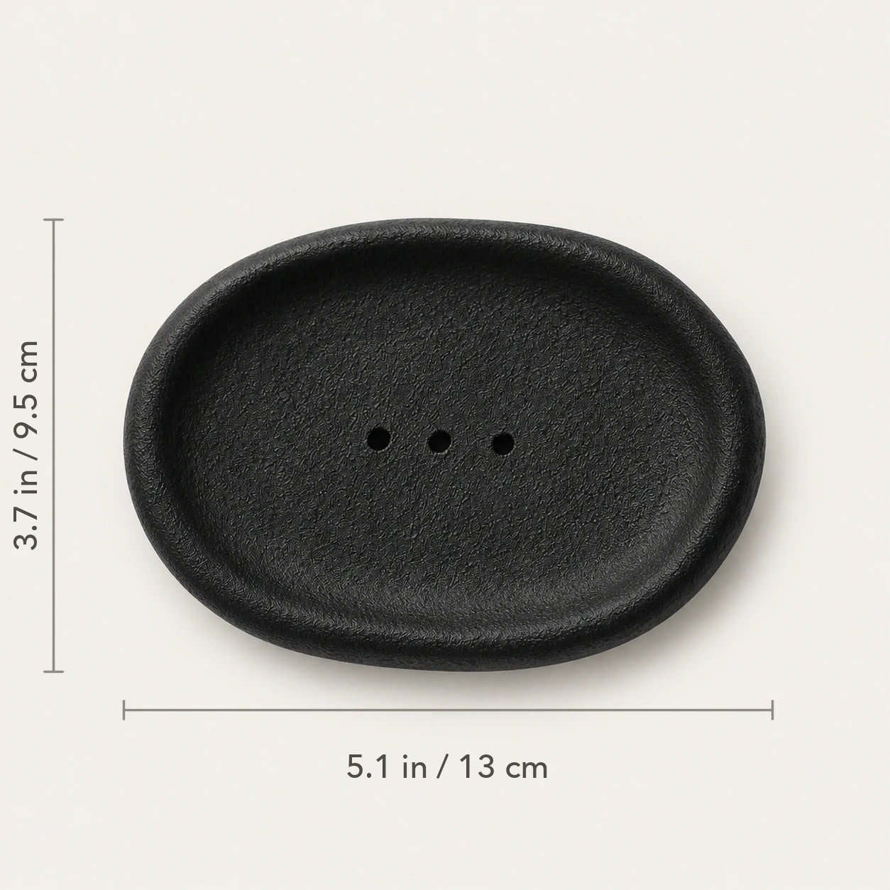 Top view of Vulcanized Obsidian ceramic dish marked 5.1 by 3.7 inches