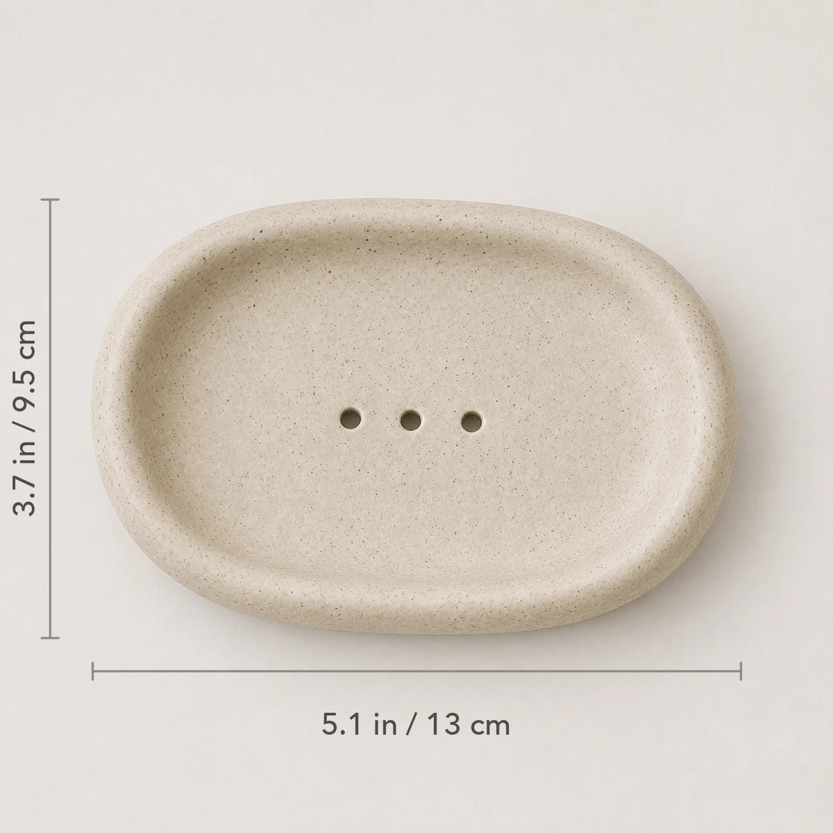 Top view of Warm Oat Sand ceramic dish marked 5.1 by 3.7 inches