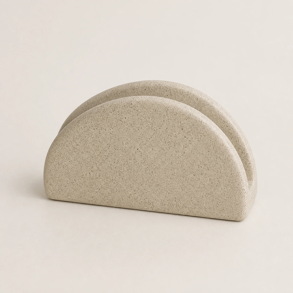 Sandstone-beige speckled ceramic napkin holder with two half-moon walls