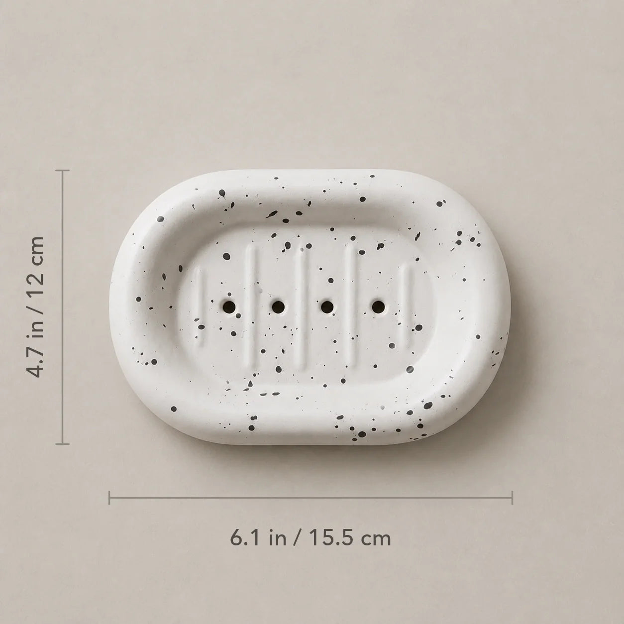 Ink splatter white rounded ceramic soap dish with 6.1 by 4.7 inch dimensions