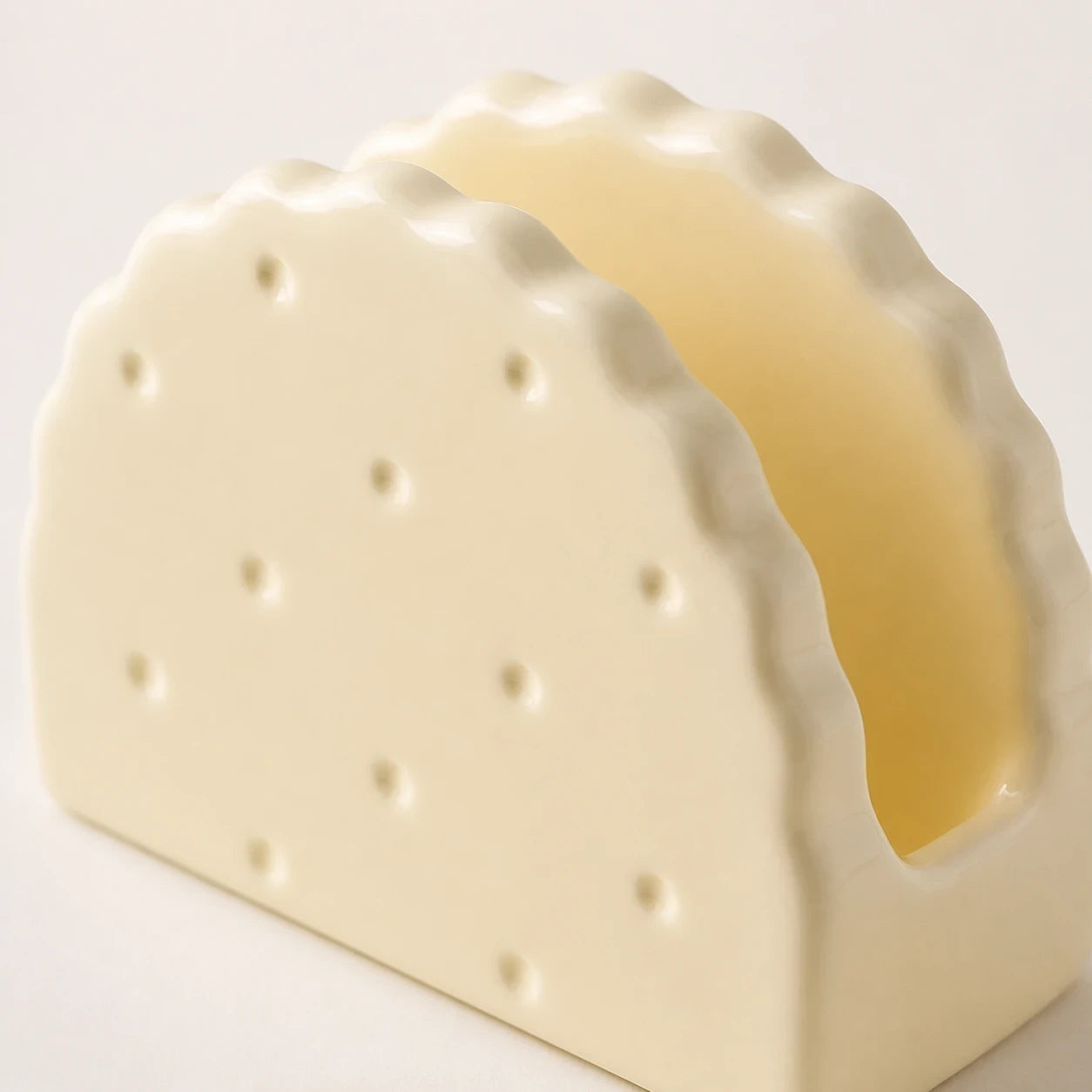Close view of Butter Cream Soda Cracker holder showing scalloped panels and one slot