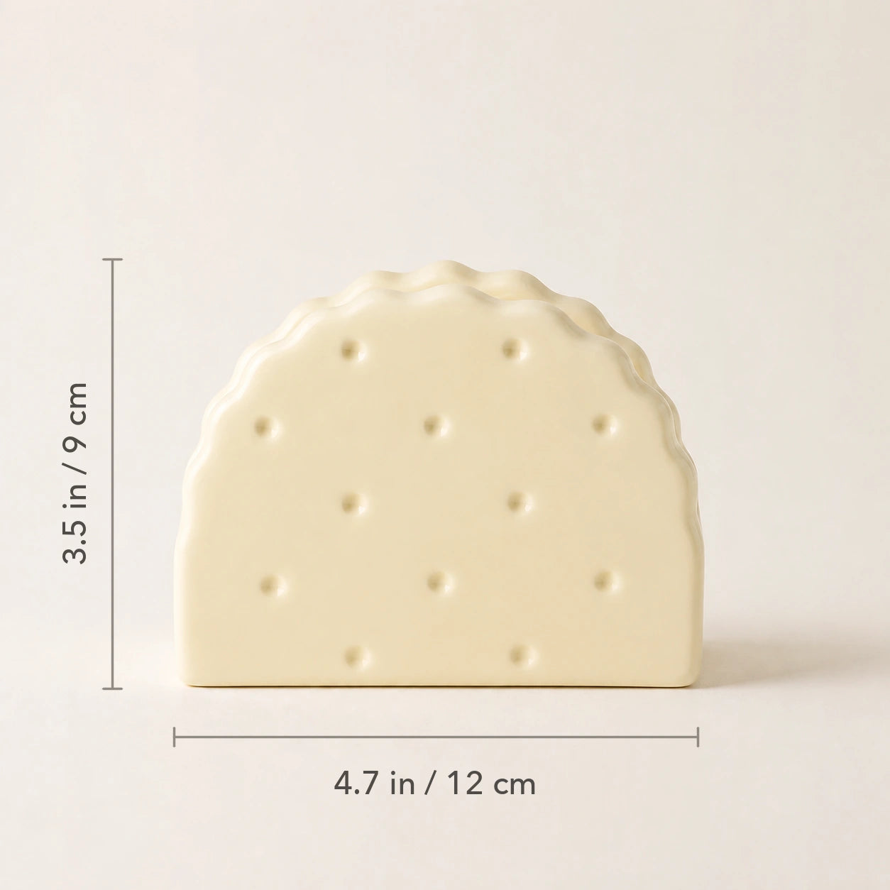 Soda Cracker Butter Cream ceramic napkin holder marked 4.7 inches wide and 3.5 inches high