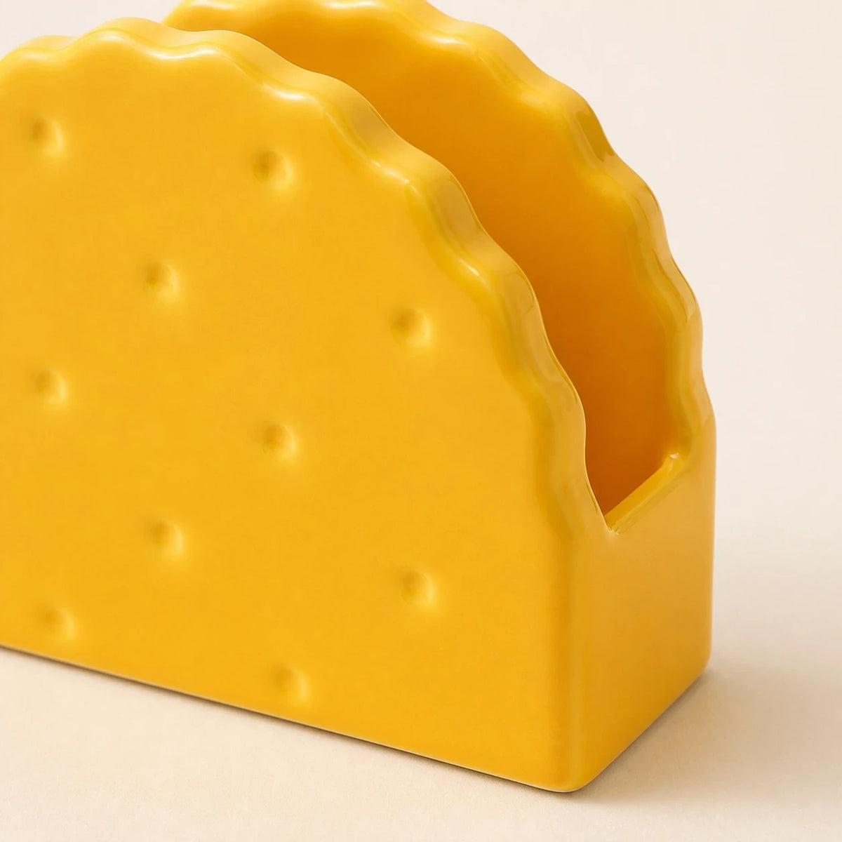 Close view of Classic Yellow Soda Cracker holder showing its glossy scalloped panels